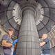 Technicians inspecting the installed center stack of the NSTX-U. Image: Elle Starkman/PPPL Office of Communications